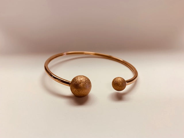Stainless Steel Rose Gold Bracelet With Glittery Tone Spheres.